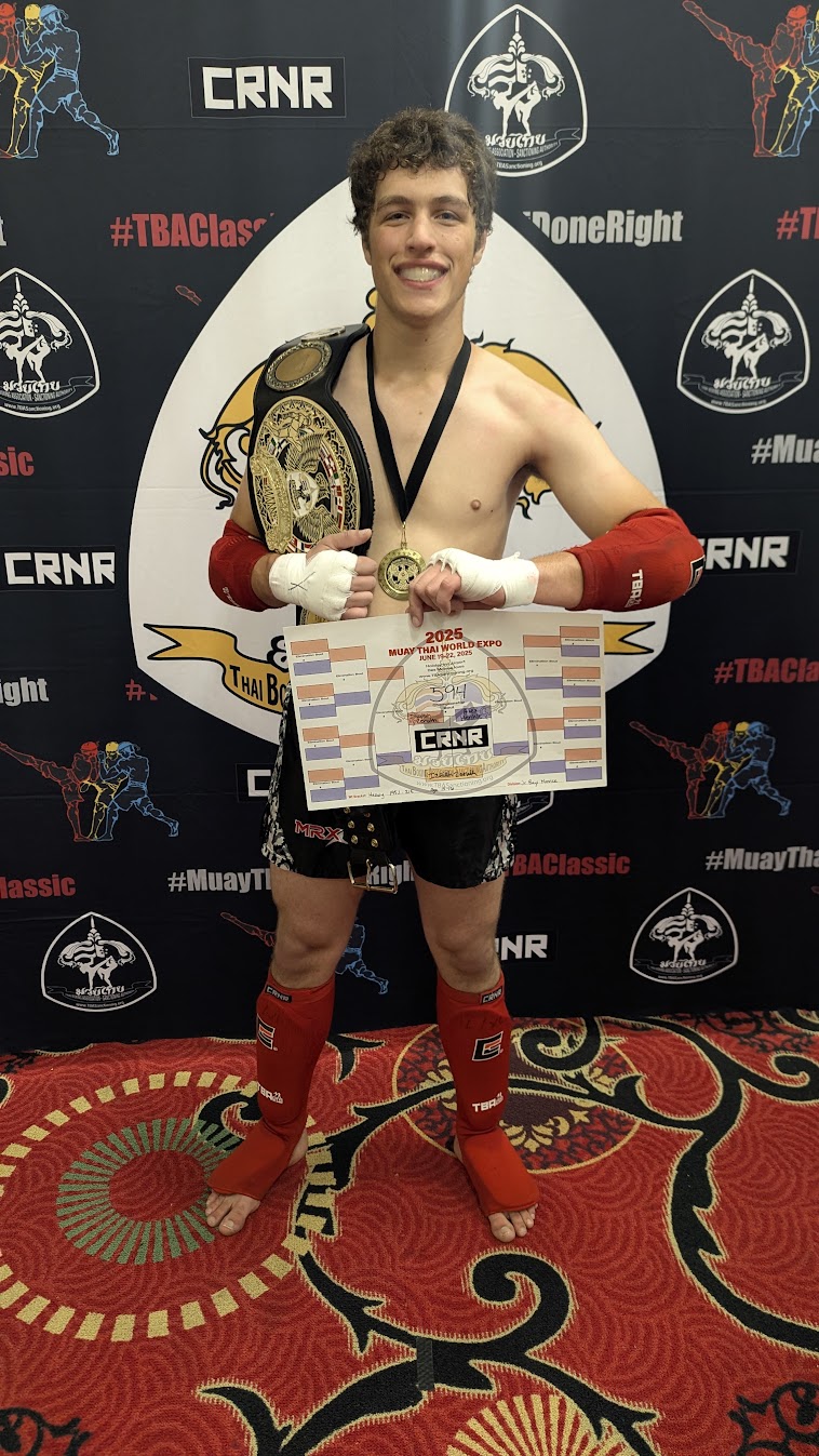 Izaiah Zeruth with his 2025 TBA Muay Thai World Expo championship belt and medal
