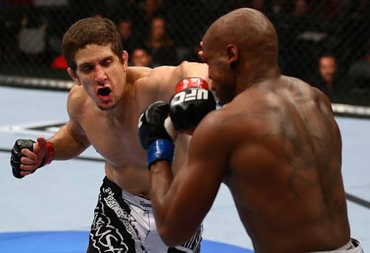 Jimy Hettes exchanging strikes during a UFC featherweight bout